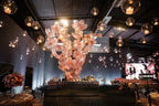 Giant organza flower sculptures surrounding the cake table - Sweet 15 celebration