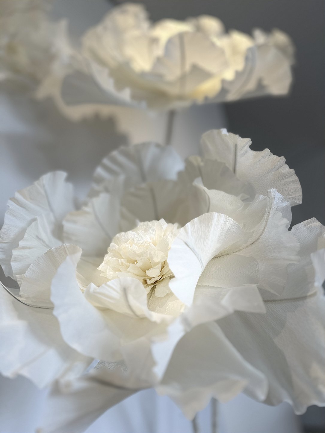 Aerial floral installation in Italian crepe paper suspended from the ceiling at Simoni Perfumaria - overview