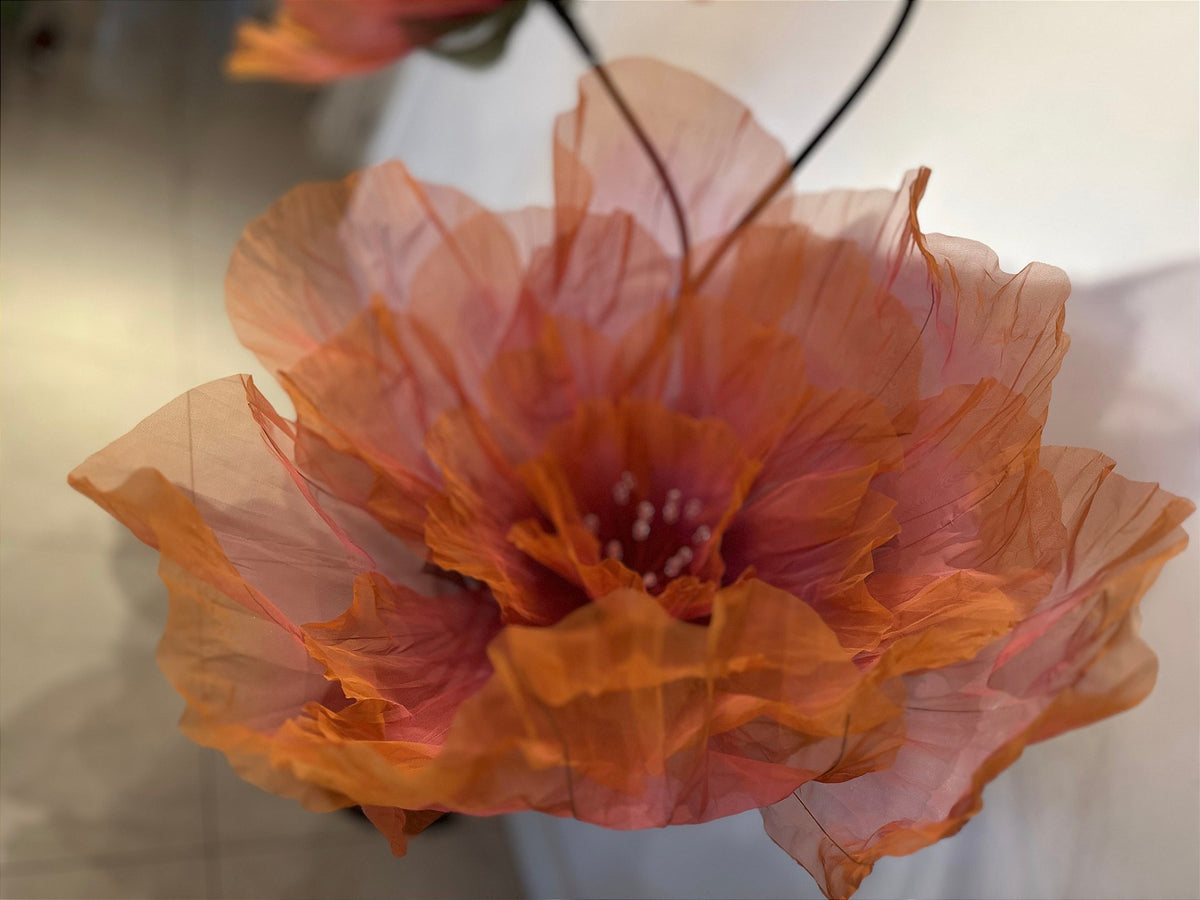 Illuminated organza floral sculpture at the trade show booth