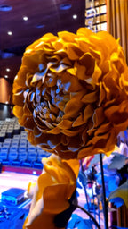 Side view of the giant floral installation in the theater