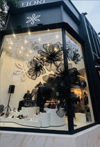 Fiore Milano storefront decorated with giant black organza flowers - overview