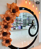 Circular mirror framed by giant EVA foam flowers - storefront installation