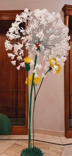Color contrast between the giant flowers and the neon sign