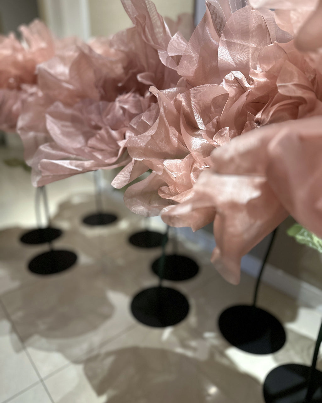 Round green bases of the organza flower stands