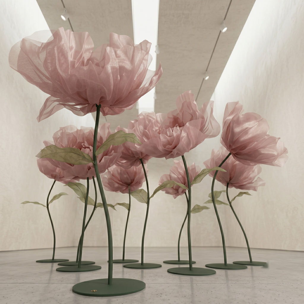 Large pink organza flower on a stand, with double layers of petals