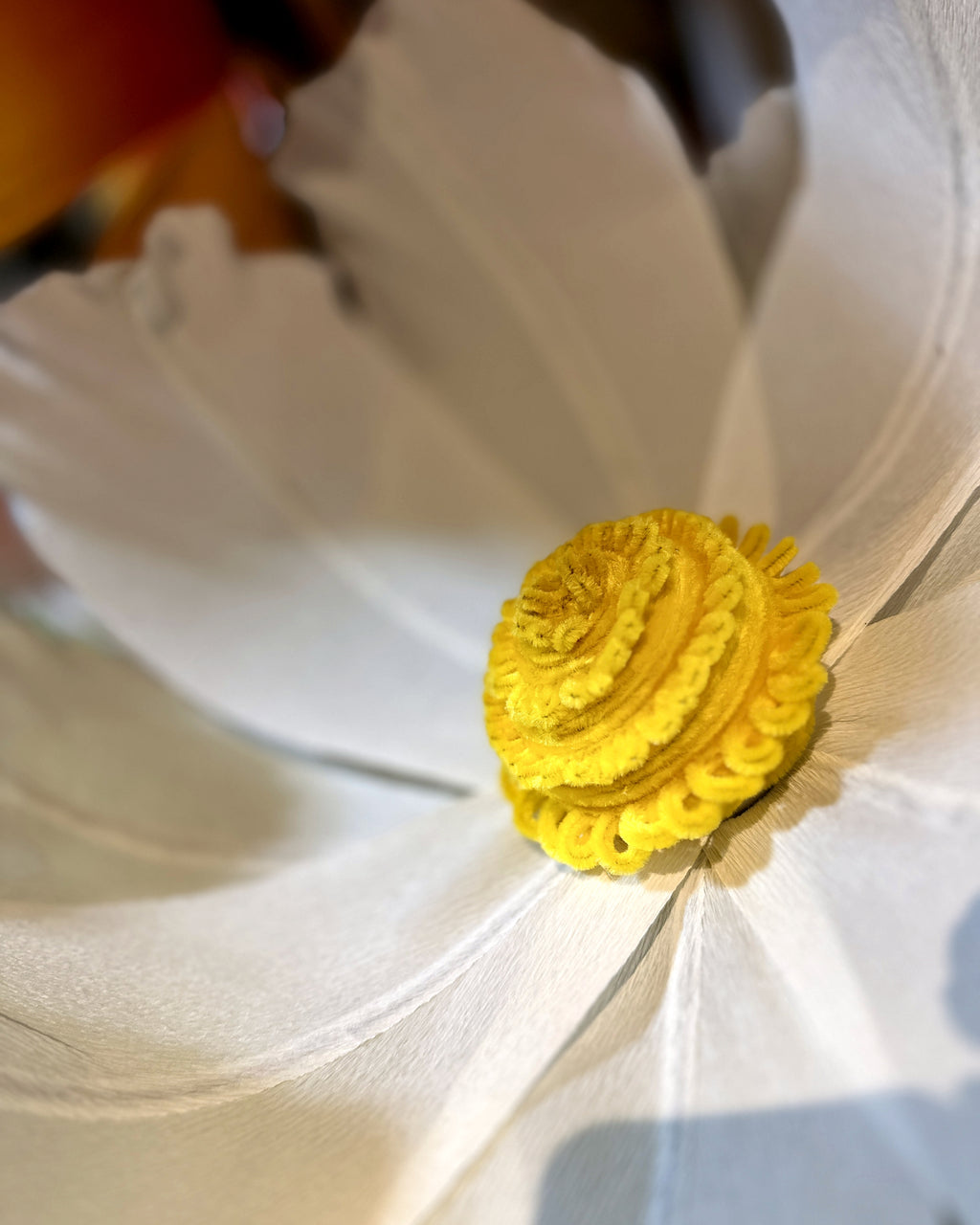 Giant white crepe paper chamomiles, center detail