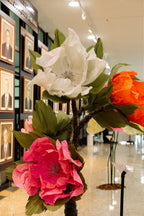 Giant organza butterflies suspended among the flowers - installation detail