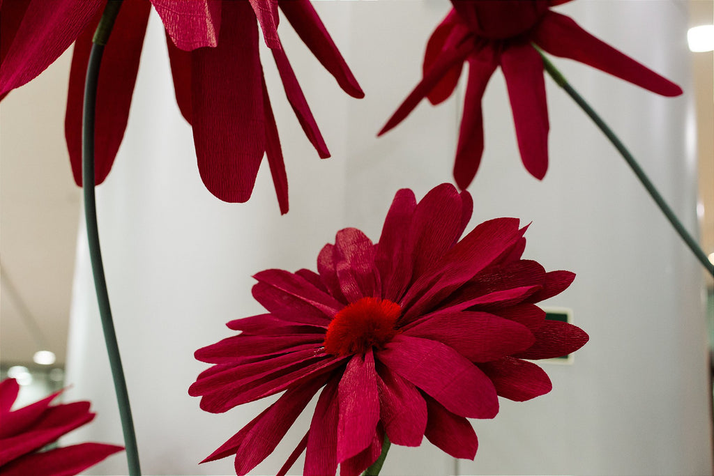 Metal stem structure supporting the giant organza flowers