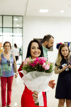 Visitors interacting with the giant rose photo panel