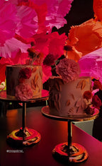 Giant Italian crepe paper flower in vibrant orange - front view