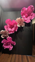 Giant Italian crepe paper flower with stage lighting highlighting its texture