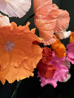 Composition of giant flowers at different heights - surreal botanical garden