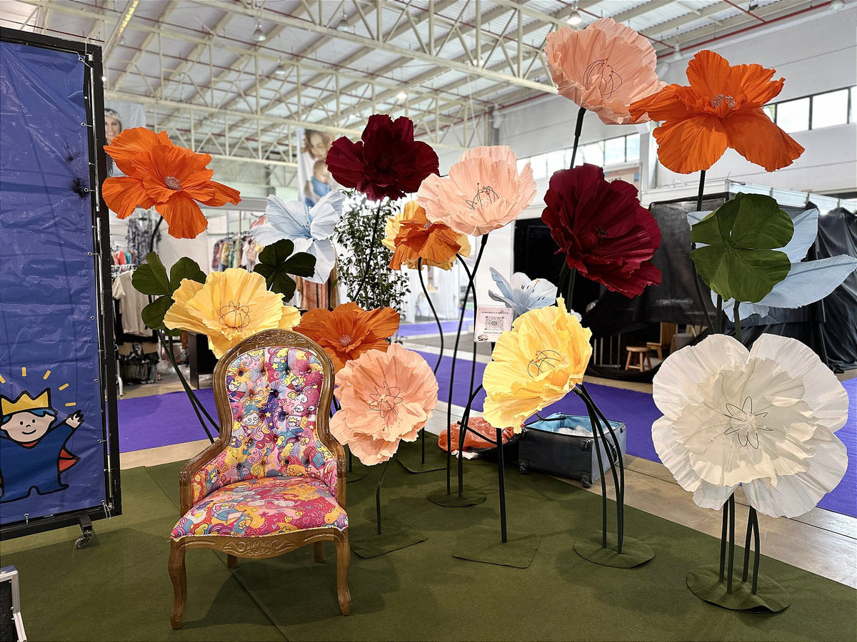 Themed armchair surrounded by giant flowers in warm tones