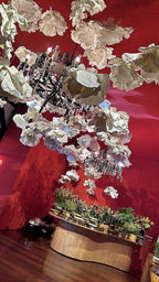 Giant white EVA foam flowers against a terracotta background - wedding wall panel