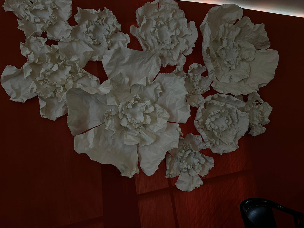 High-relief floral composition on the hall's terracotta wall