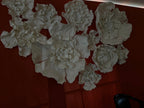 High-relief floral composition on the hall's terracotta wall