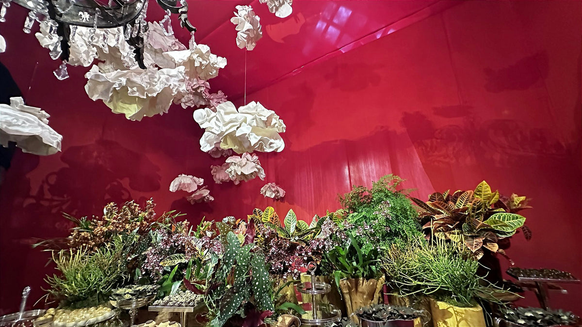 Suspended garden interspersed with crystal chandeliers - wedding floral installation