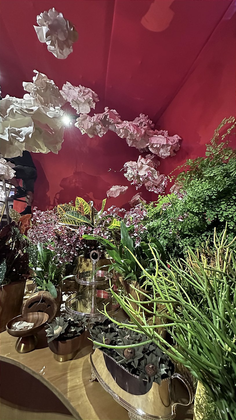 Floral panel serving as the backdrop for wedding photos