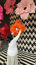 Final composition of the storefront with a suspended garden of giant flowers