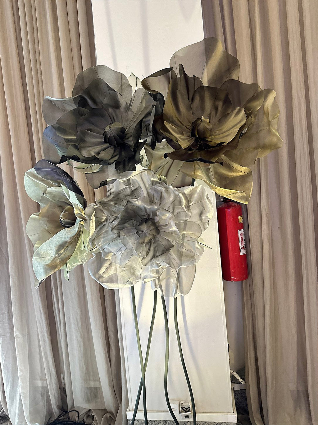 Sinuous stems with organza flowers at varying heights - institutional floral installation
