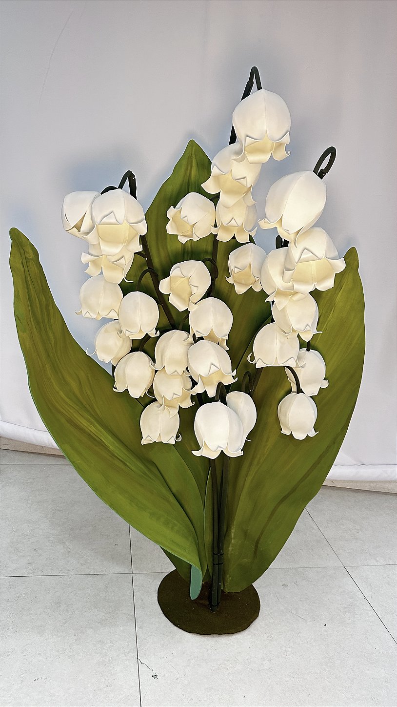 Floral frame for the couple - giant Lily of the Valley and green foliage