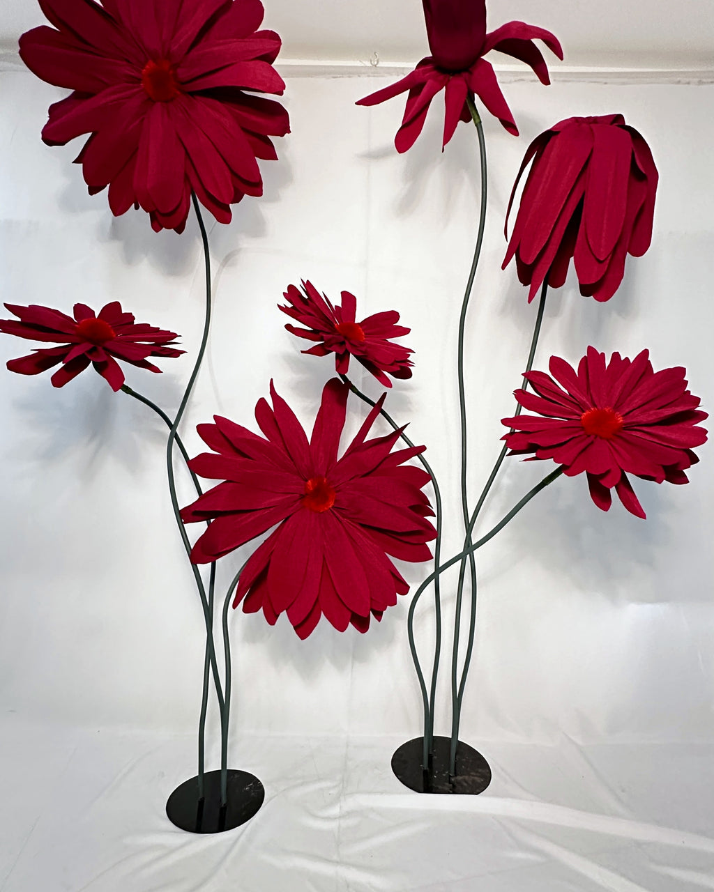 Giant crepe paper daisy backdrop for party and window display decor