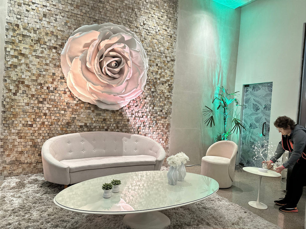 Side view of the giant rose integrated into the textured wall