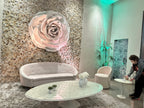 Side view of the giant rose integrated into the textured wall