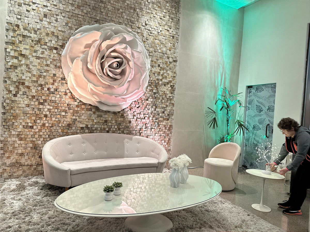 Side view of the giant rose integrated into the textured wall