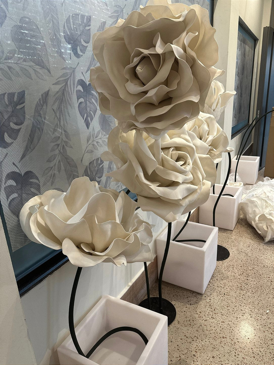 Guests photographing the lounge decorated with the giant EVA foam rose