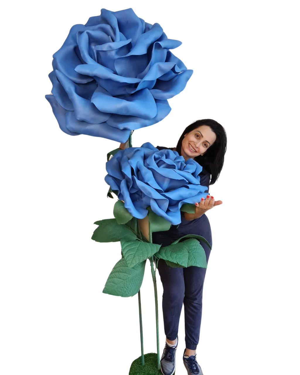 Giant roses on a pedestal styled into a decorated space